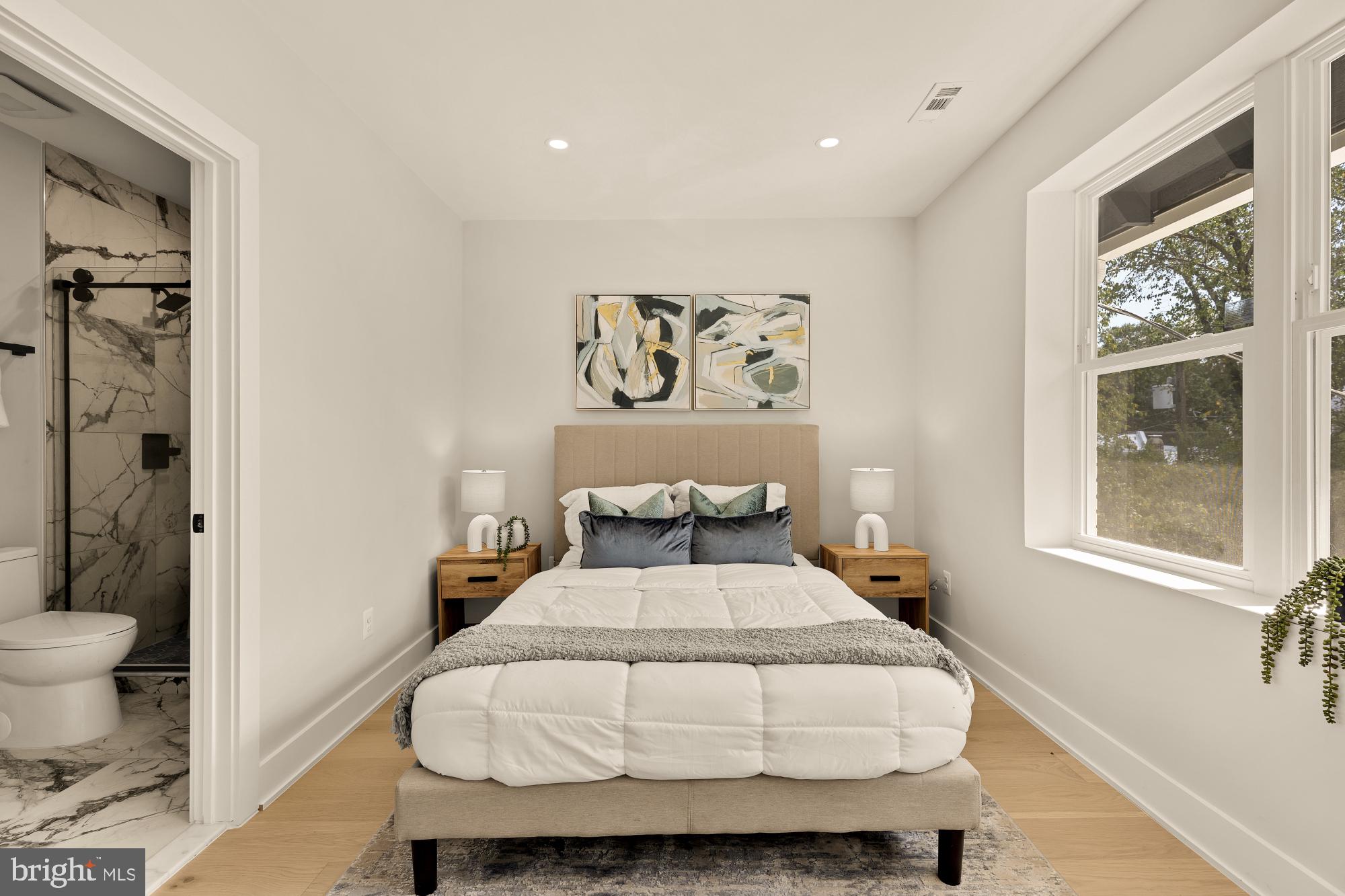 815 Marietta Place Northwest Washington, DC 20011 - Photo 32 of 44 a bedroom with a large bed and a window