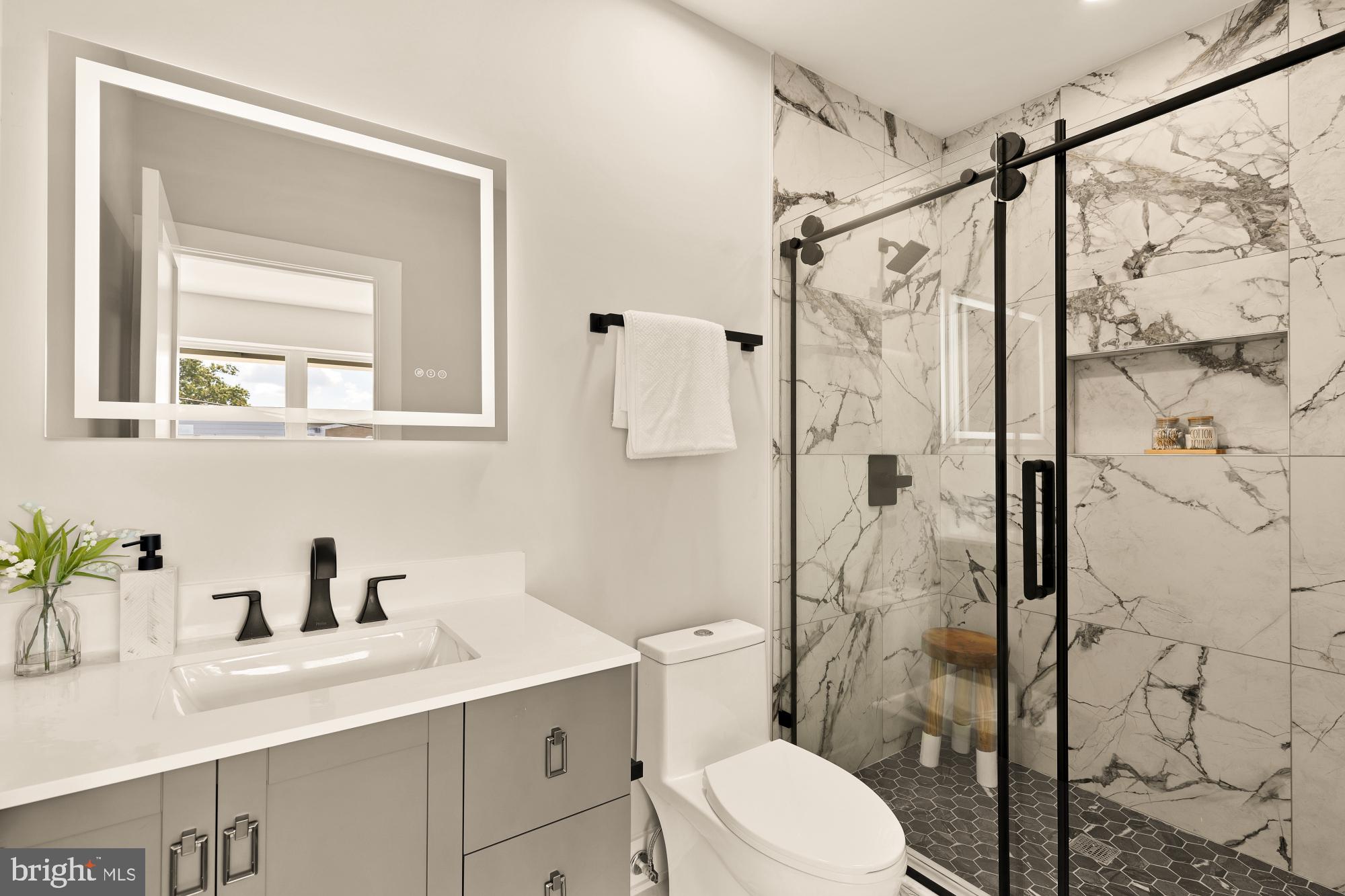 815 Marietta Place Northwest Washington, DC 20011 - Photo 34 of 44 a bathroom with a sink vanity granite toilet and shower