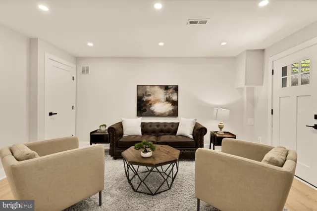 a living room with furniture and a rug