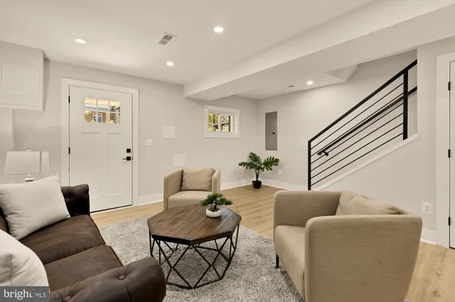 a living room with furniture and a rug