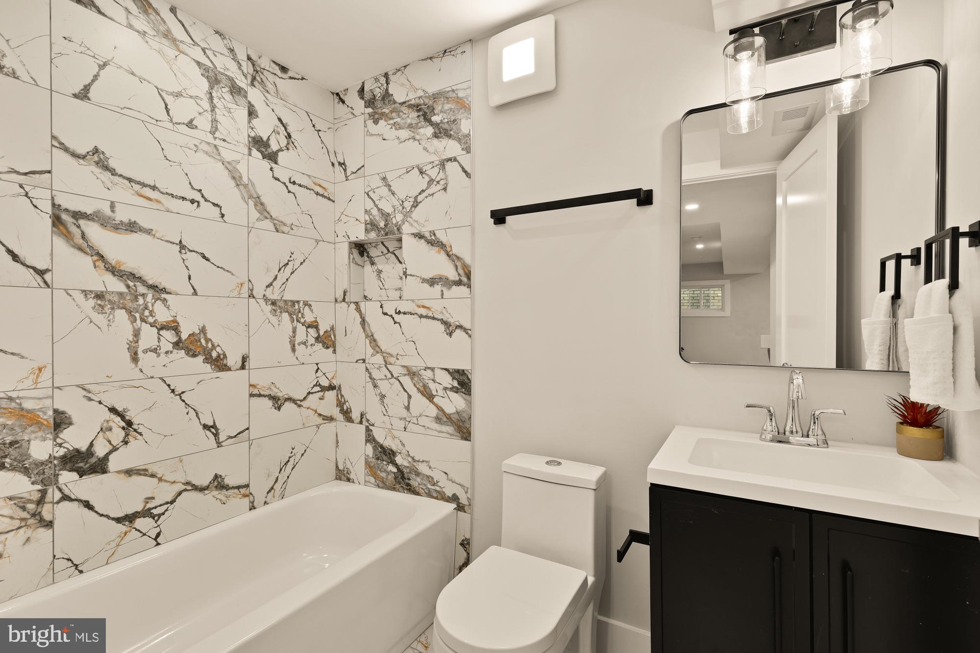 815 Marietta Place Northwest Washington, DC 20011 - Photo 38 of 44 a bathroom with a sink toilet and shower