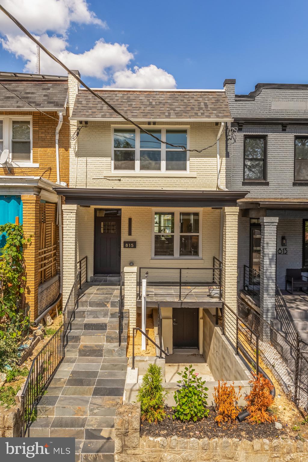 815 Marietta Place Northwest Washington, DC 20011 - Photo 43 of 44 a front view of a residential apartment building with a yard