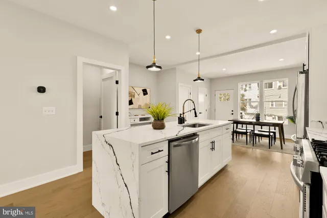 a large kitchen with a lot of counter space and a sink