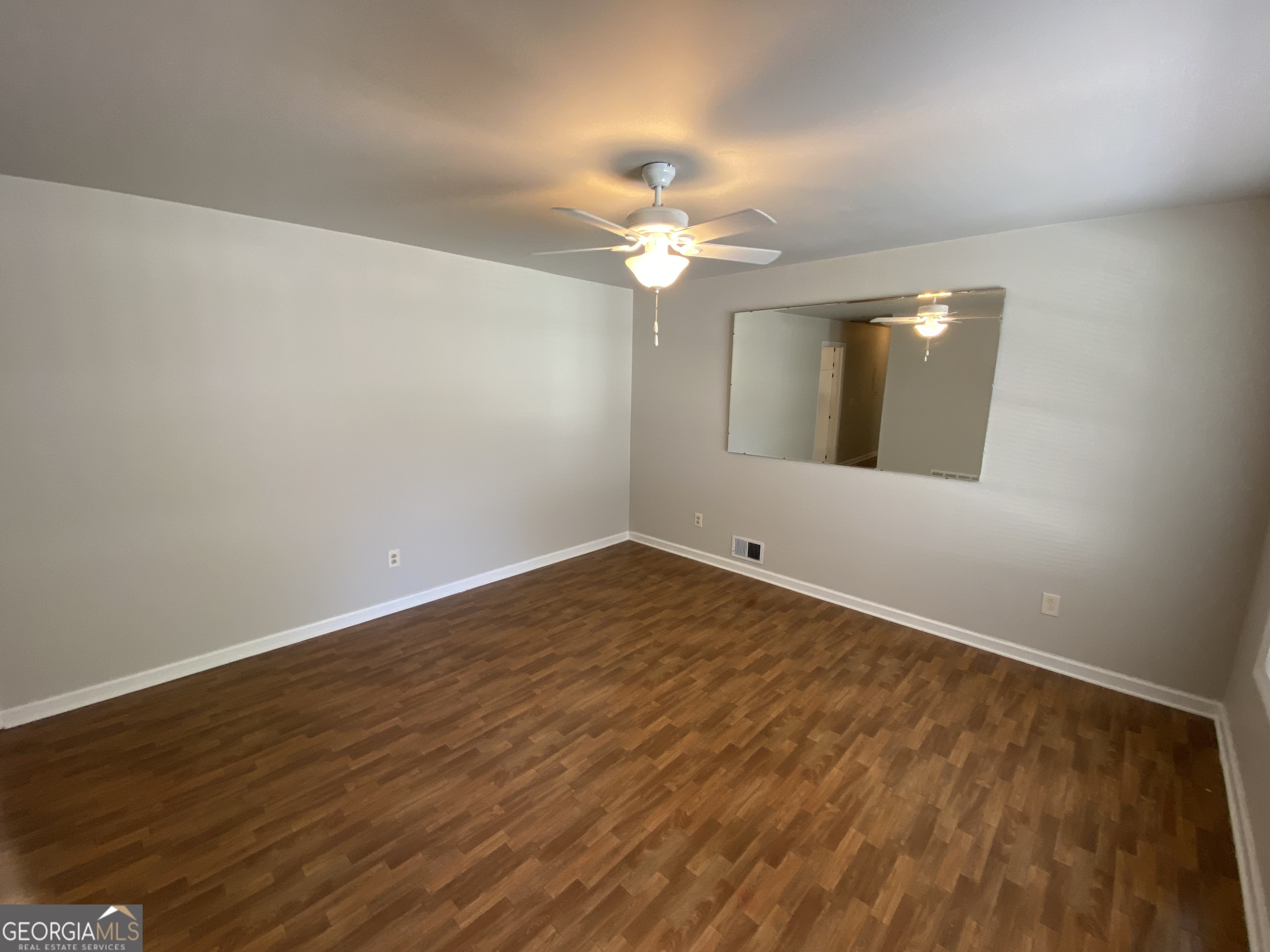 6092 Prestige Valley Road Morrow, GA 30260 - Photo 7 of 11 wooden floor in an empty room with a window