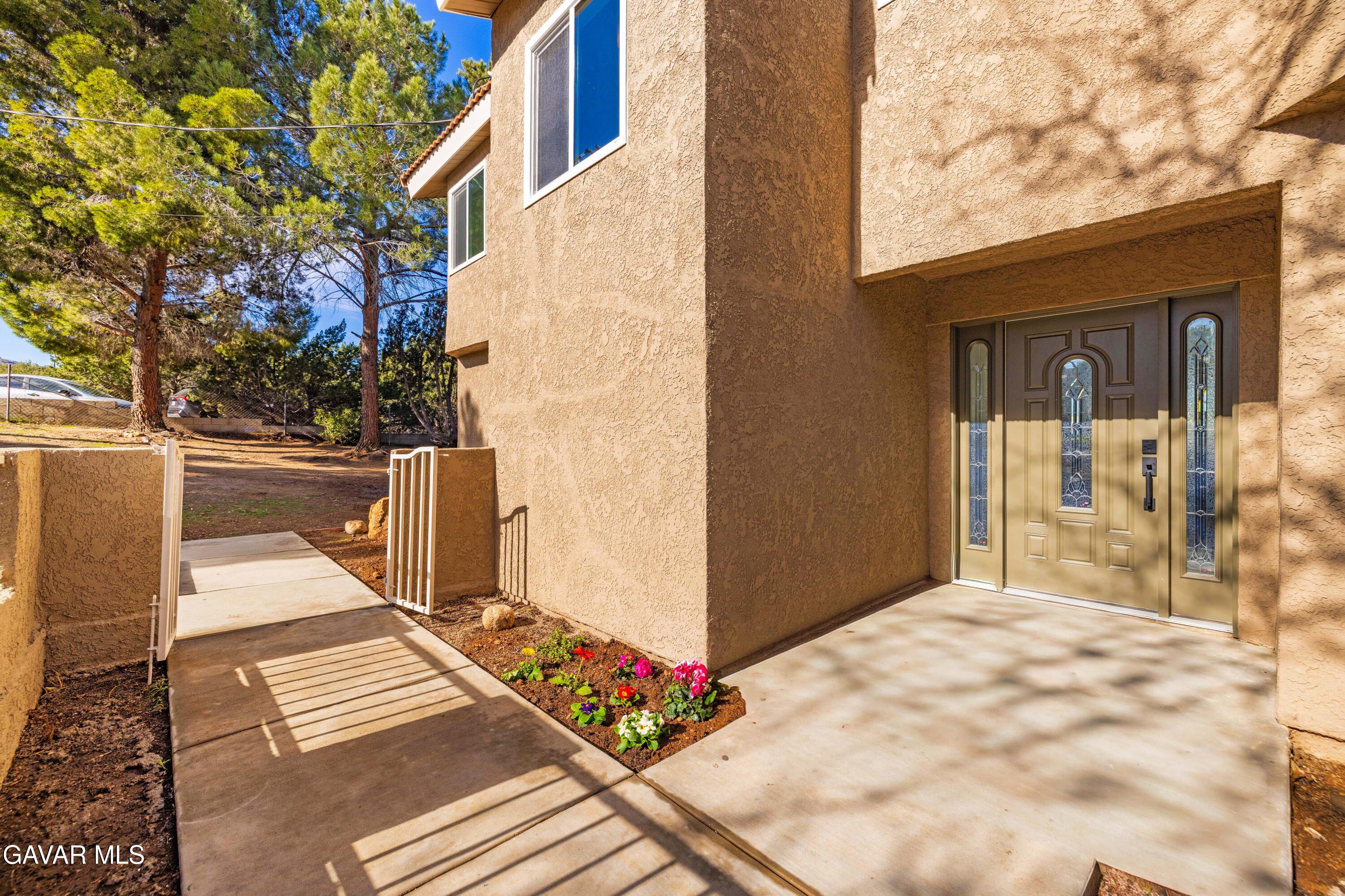 329 East Lago Lindo Road Palmdale, CA 93550 - Photo 17 of 39 a view of a balcony with wooden floor
