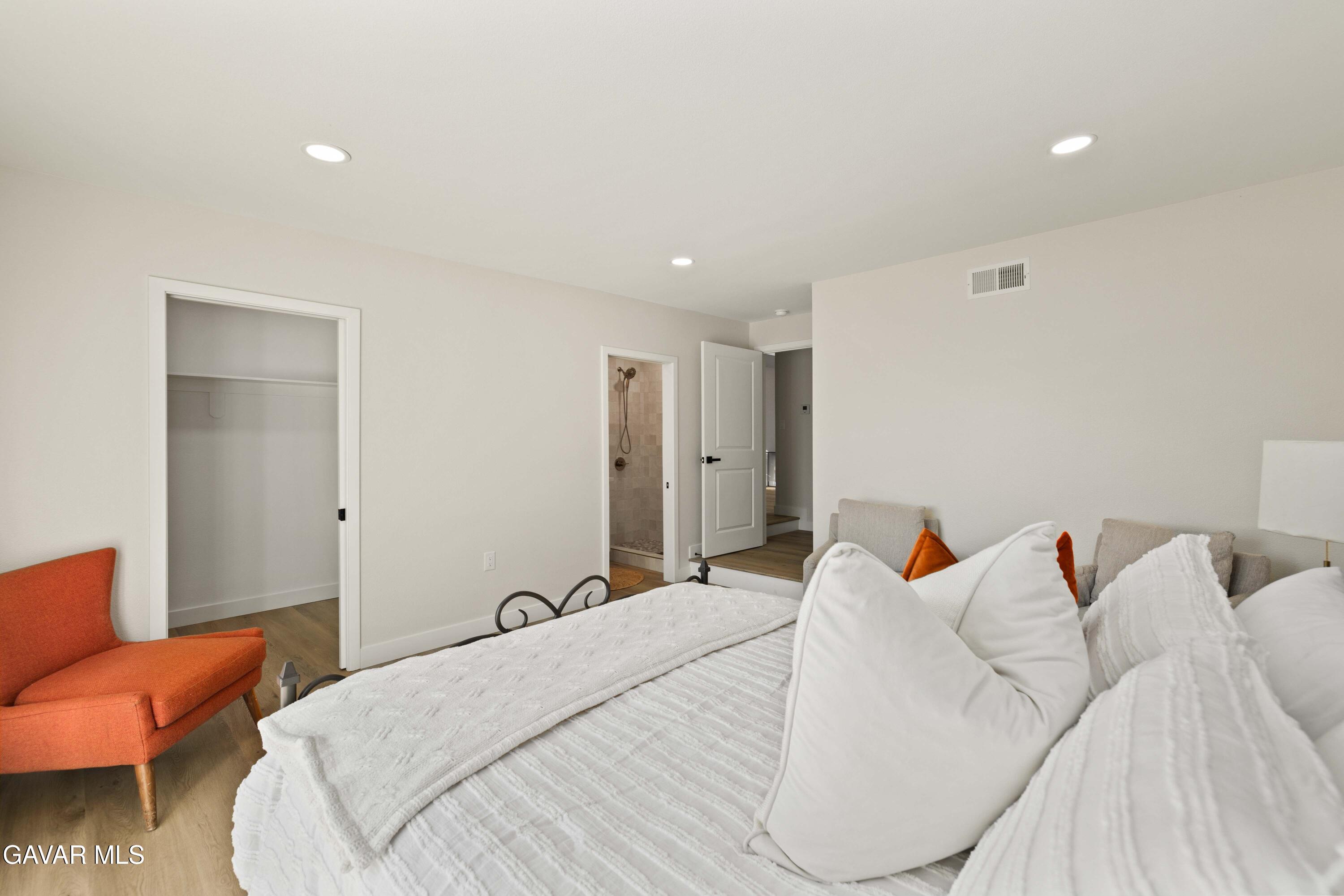 329 East Lago Lindo Road Palmdale, CA 93550 - Photo 26 of 39 a bedroom with bed and a couch