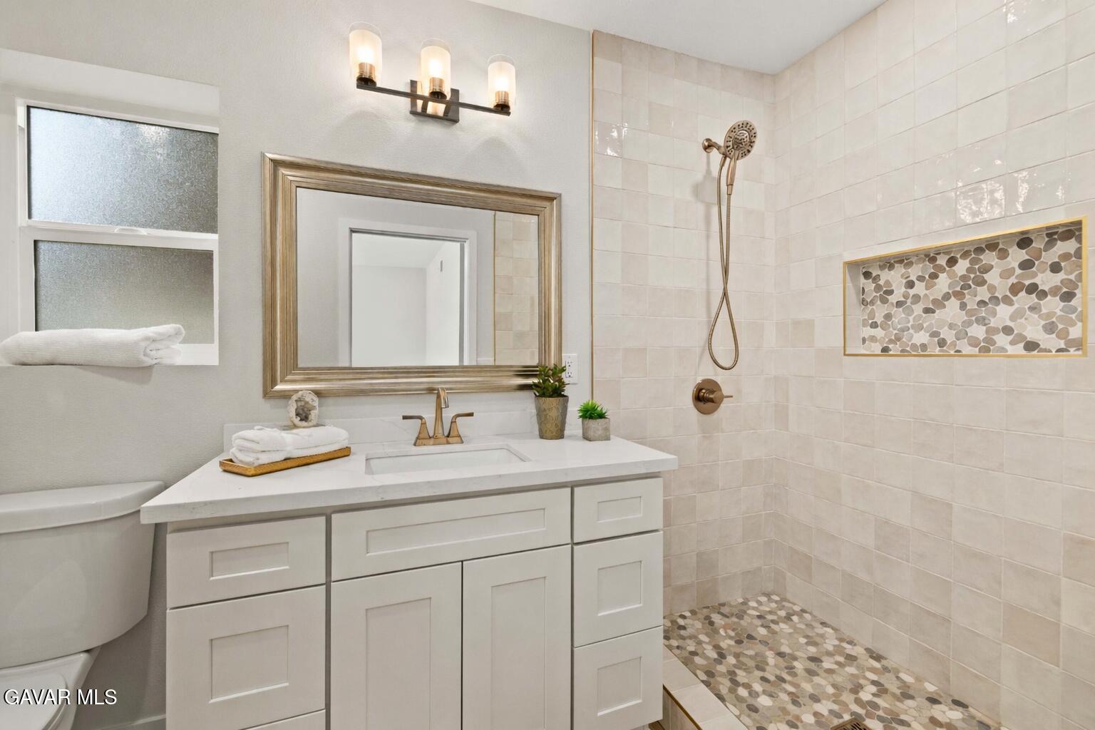 329 East Lago Lindo Road Palmdale, CA 93550 - Photo 27 of 39 a bathroom with a sink a toilet and shower