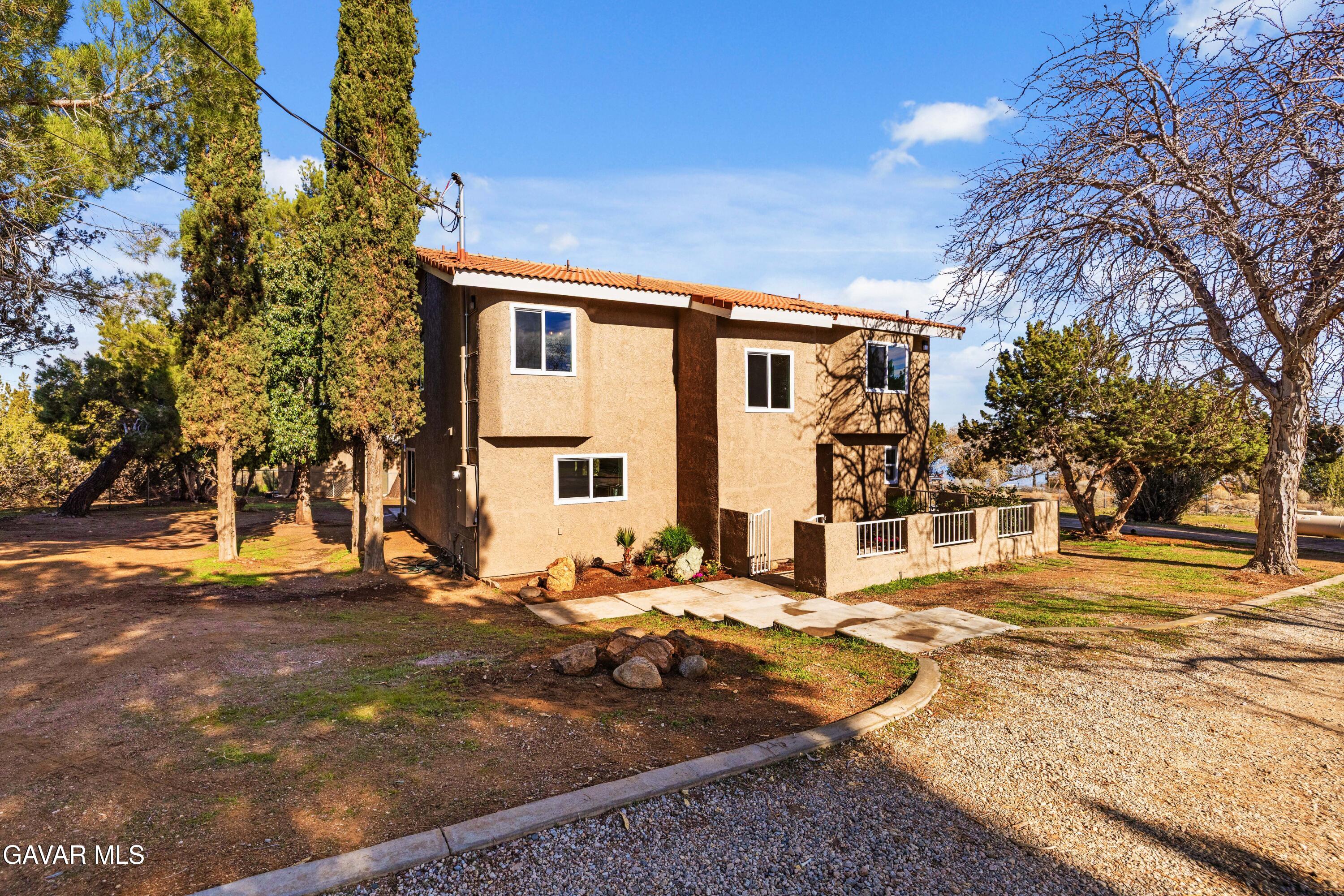 329 East Lago Lindo Road Palmdale, CA 93550 - Photo 32 of 39 a view of a house with snow on the road