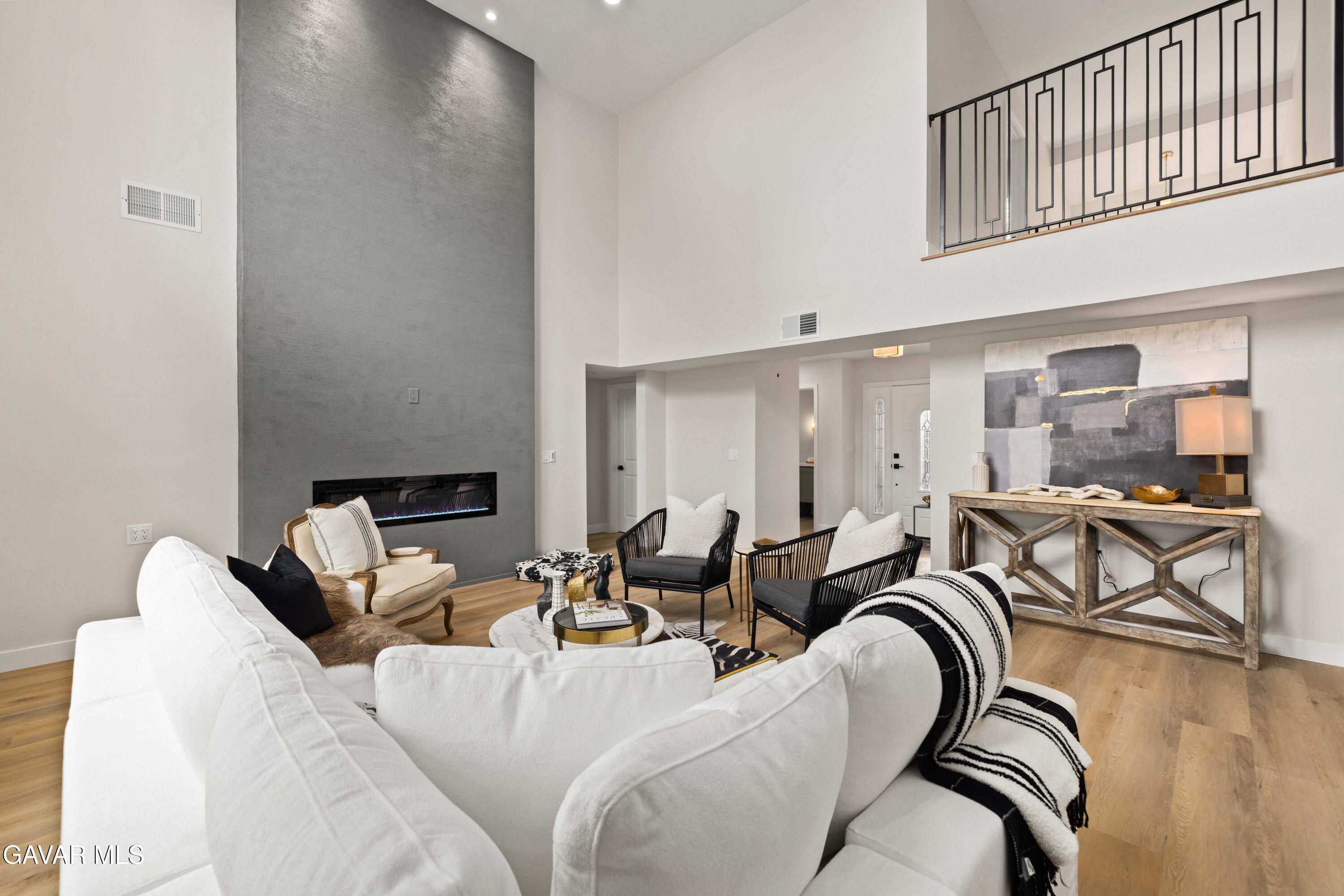 329 East Lago Lindo Road Palmdale, CA 93550 - Photo 6 of 39 a living room with furniture and a dining table