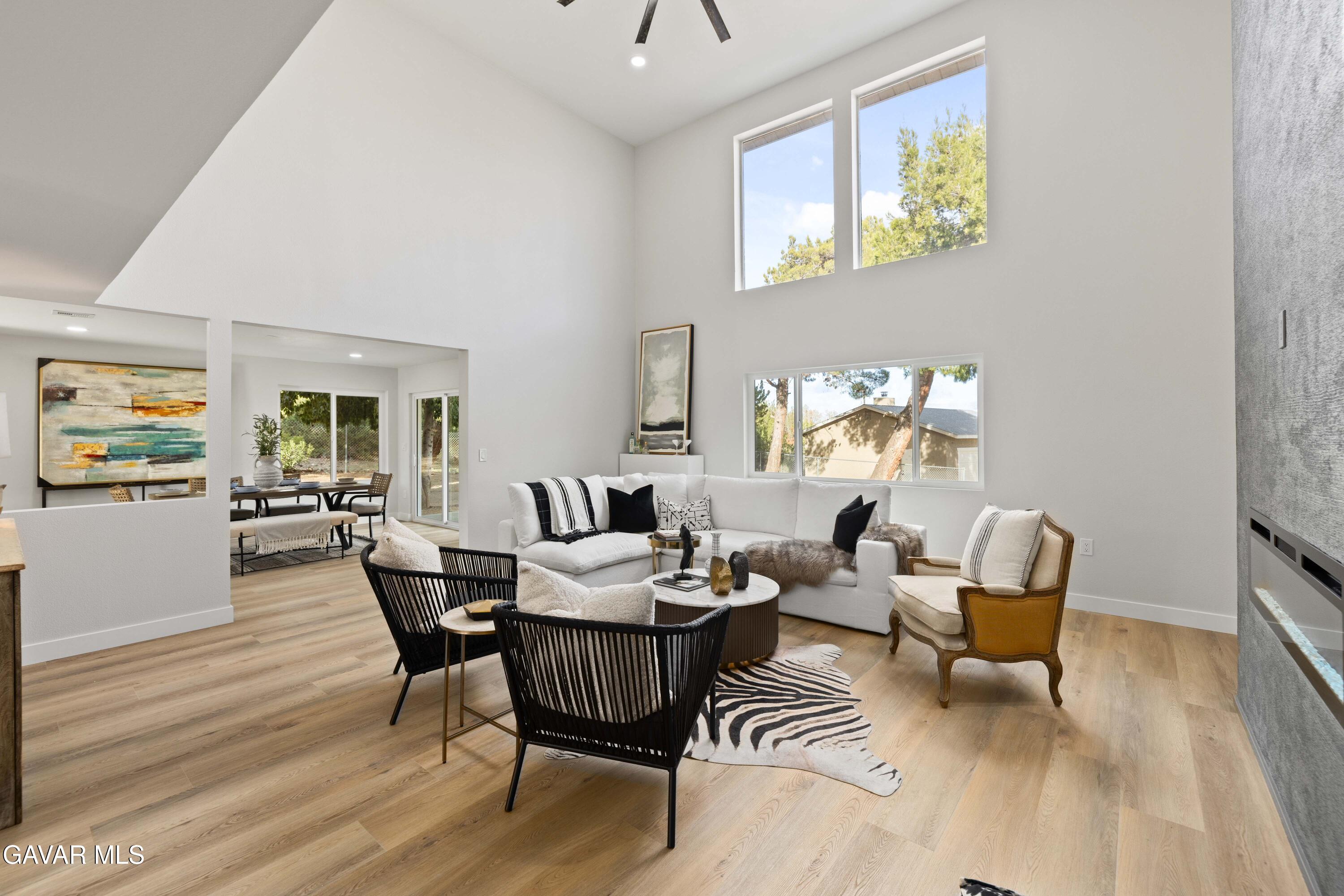 329 East Lago Lindo Road Palmdale, CA 93550 - Photo 7 of 39 a view of a dining room with furniture and wooden floor