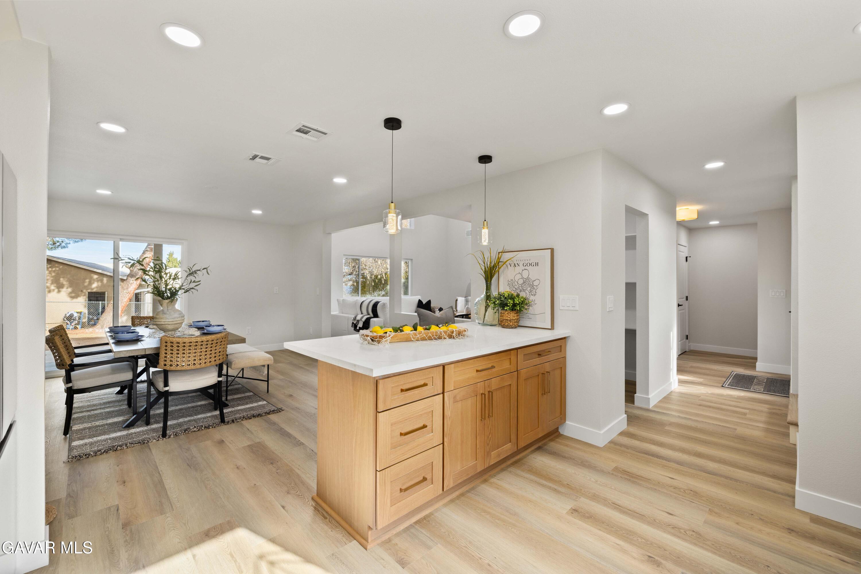 329 East Lago Lindo Road Palmdale, CA 93550 - Photo 10 of 39 a large kitchen with a table and chairs