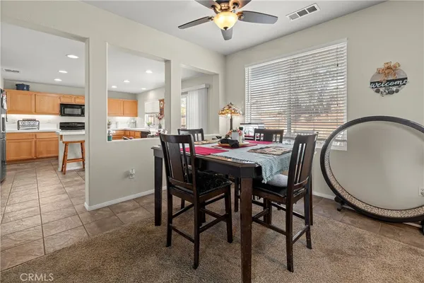 a dining room with furniture and window