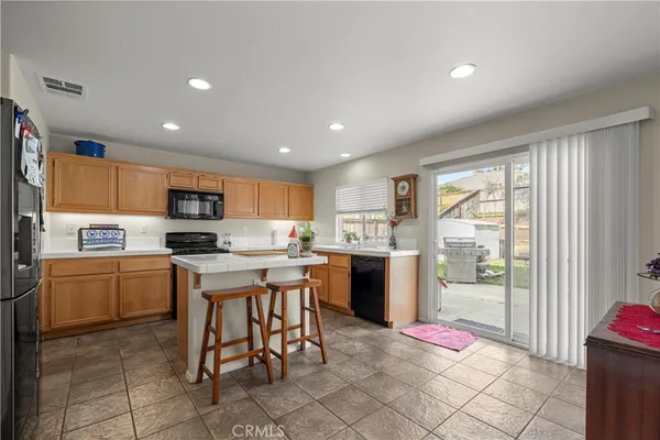 a kitchen with a sink a counter top space and appliances