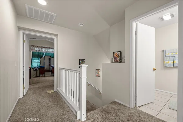 a view of a hallway with rooms