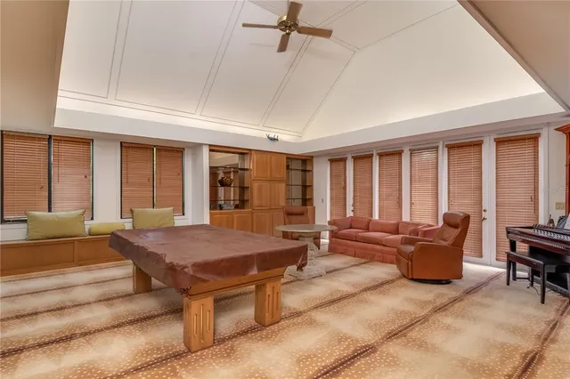 a living room with furniture and large window