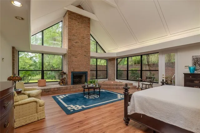 a large bedroom with a large window and a balcony