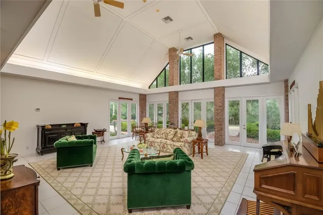 a living room with fireplace furniture and a flat screen tv