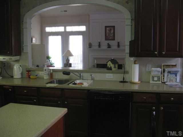 3905 Sunset Maple Court Raleigh, NC 27612 - Photo 7 of 19 Arched pass through from the kitchen to the living room.