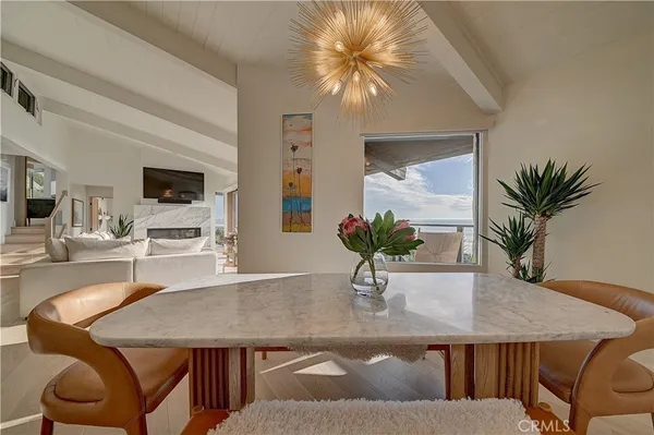 a large kitchen with a table and chairs
