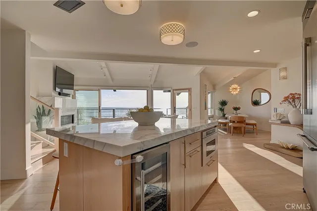 a large kitchen with a table and chairs
