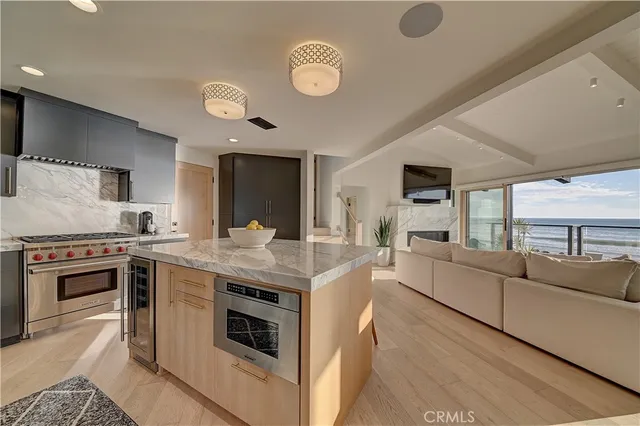 a kitchen with stainless steel appliances granite countertop a stove and a sink