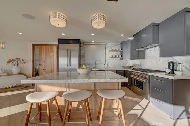 a bedroom with a large bed and a large window