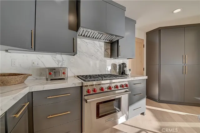 a bedroom with a large bed and a flat tv screen on dresser