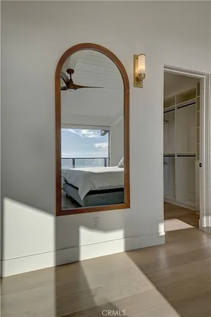 a bedroom with a bed and a potted plant