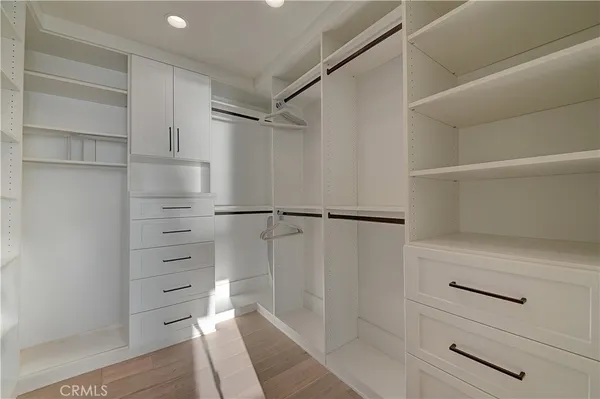a bed room with a bed and a large window