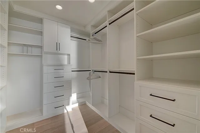 a bed room with a bed and a large window