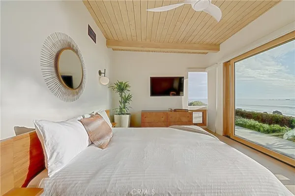 a room with a large bed and a large window