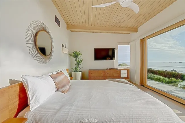 a room with a large bed and a large window