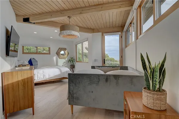 a view of a terrace with furniture and city view