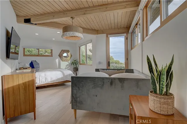 a view of a terrace with furniture and city view