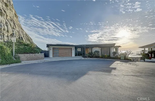 a living room with furniture a flat screen tv and a large window