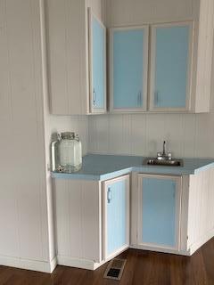 144 Holm Road, Unit 119 Watsonville, CA 95076 - Photo 11 of 29 a kitchen with granite countertop a sink and cabinets