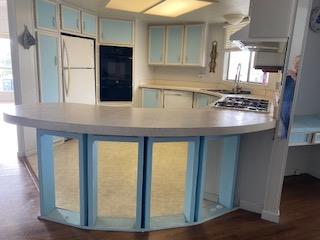 144 Holm Road, Unit 119 Watsonville, CA 95076 - Photo 12 of 29 a kitchen with stainless steel appliances granite countertop a refrigerator and a sink