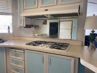 144 Holm Road, Unit 119 Watsonville, CA 95076 - Photo 14 of 29 a kitchen with stainless steel appliances granite countertop a sink stove and cabinets