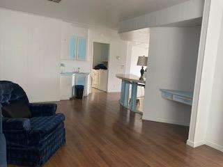 144 Holm Road, Unit 119 Watsonville, CA 95076 - Photo 16 of 29 a living room with furniture and a wooden floor