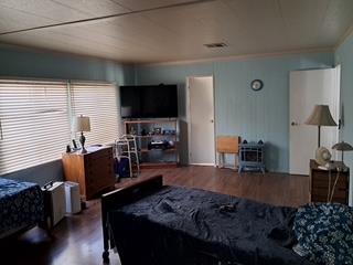 144 Holm Road, Unit 119 Watsonville, CA 95076 - Photo 23 of 29 a living room with furniture a flat screen tv and kitchen view