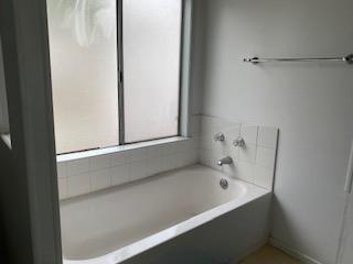 144 Holm Road, Unit 119 Watsonville, CA 95076 - Photo 25 of 29 a bathroom with a bathtub