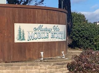 144 Holm Road, Unit 119 Watsonville, CA 95076 - Photo 28 of 29 a sign on the side of a building