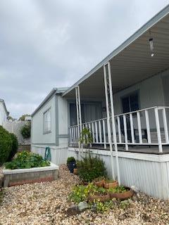 144 Holm Road, Unit 119 Watsonville, CA 95076 - Photo 5 of 29 a front view of a house with garden