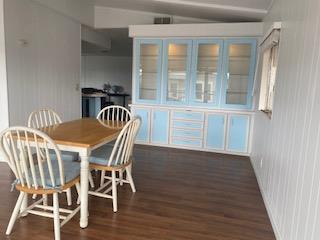 144 Holm Road, Unit 119 Watsonville, CA 95076 - Photo 10 of 29 a view of a dining room with furniture and wooden floor