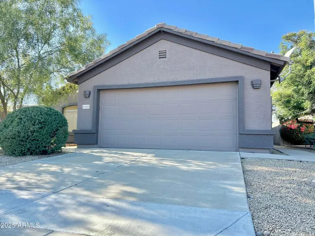 a view of a house with a yard and garage