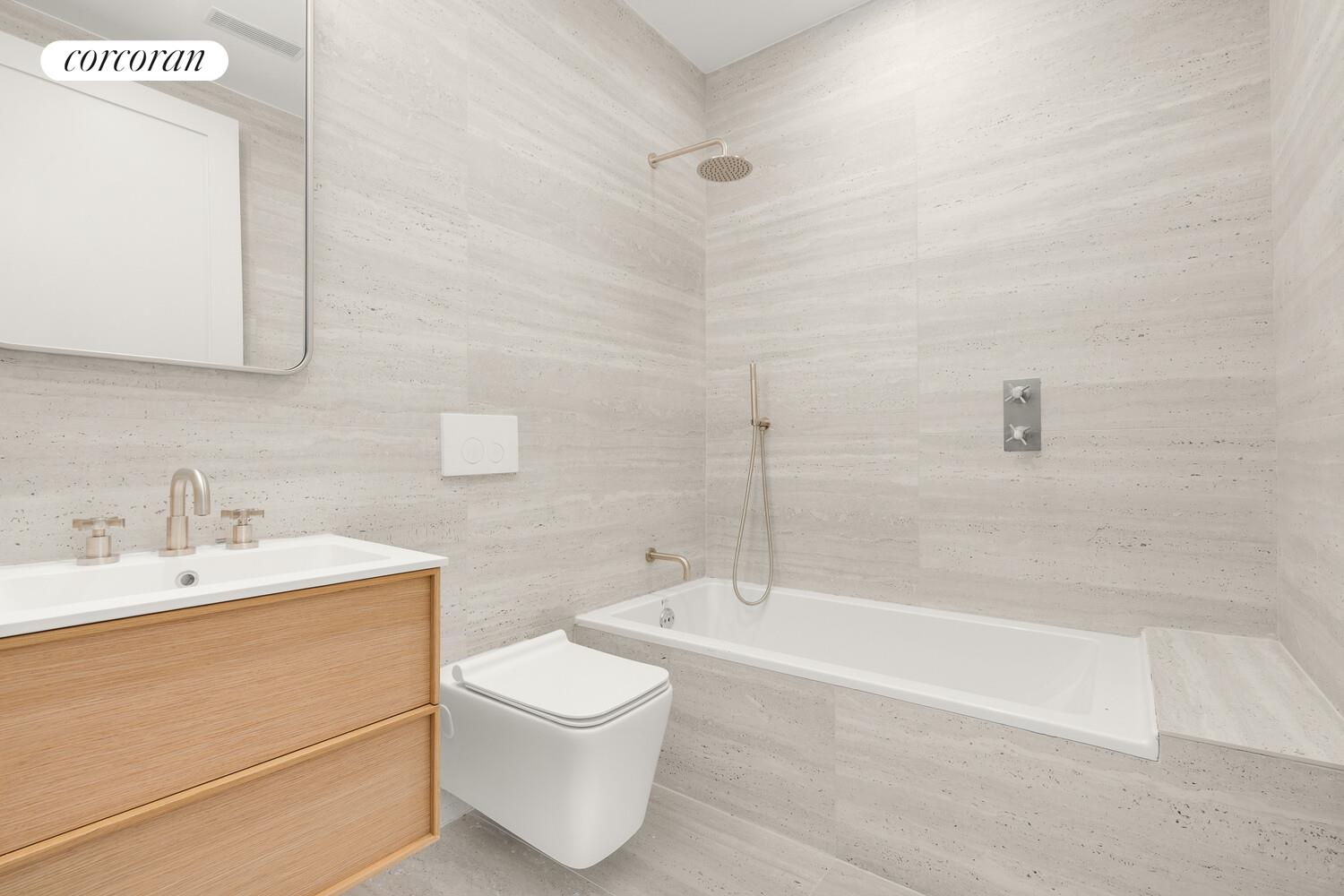 1148 Decatur Street Brooklyn, NY 11207 - Photo 11 of 14 a bathroom with a sink a toilet and shower