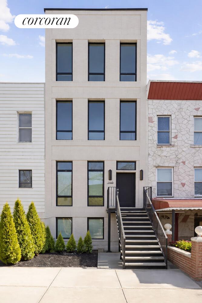 1148 Decatur Street Brooklyn, NY 11207 - Photo 12 of 14 a view of a house with more windows and brick walls