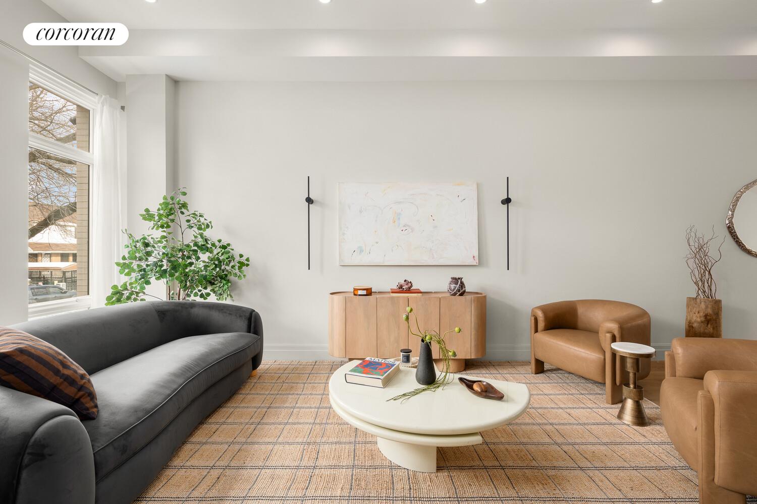 a living room with furniture and a window