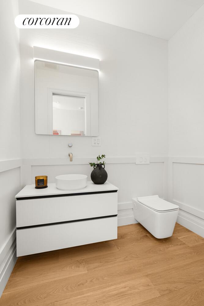 1148 Decatur Street Brooklyn, NY 11207 - Photo 6 of 14 a bathroom with a sink and a mirror