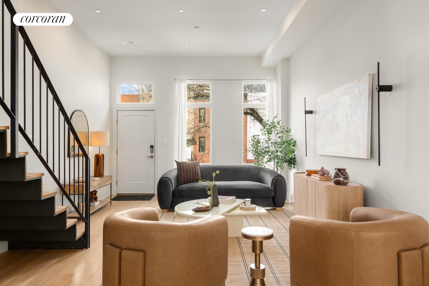 1148 Decatur Street Brooklyn, NY 11207 - Photo 7 of 14 a living room with furniture and a potted plant